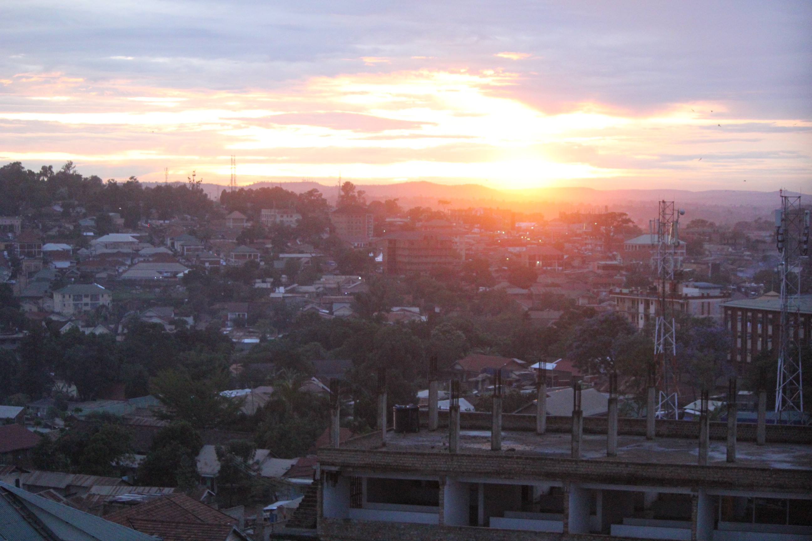 a sunset over a city